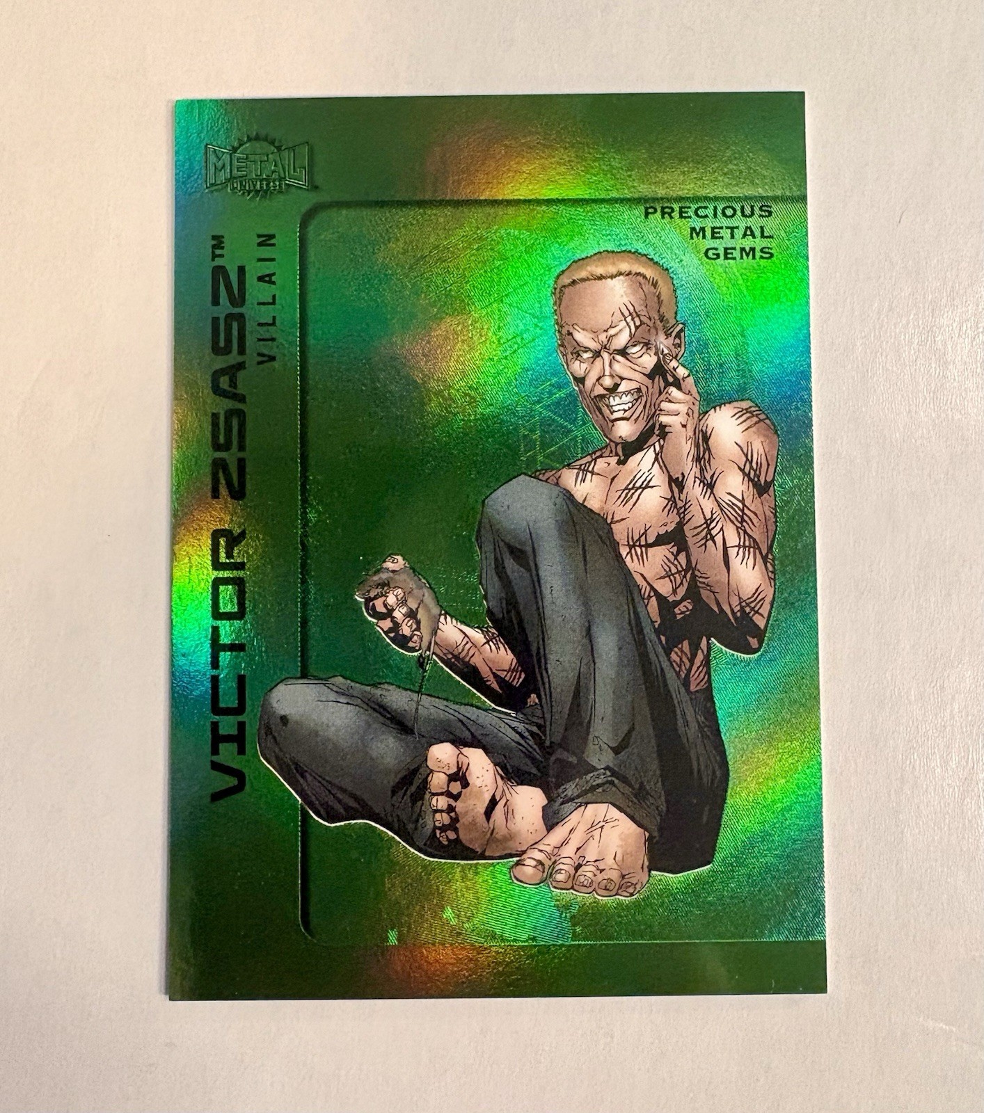 2025 Skybox Metal Universe Batman High Series Green PMG #01/10 Victor Zsasz #103 2025 Skybox Metal Universe Batman High Series Green PMG #01/10 Victor Zsasz #103