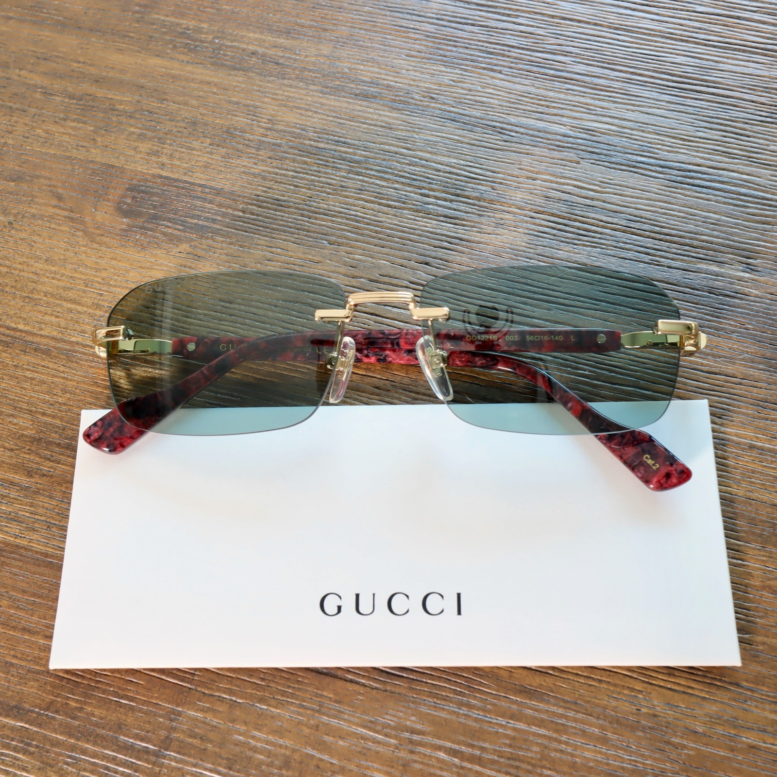 Gucci GG1221S 003 56mm Rectangle Sunglasses in Gold/Green Lens