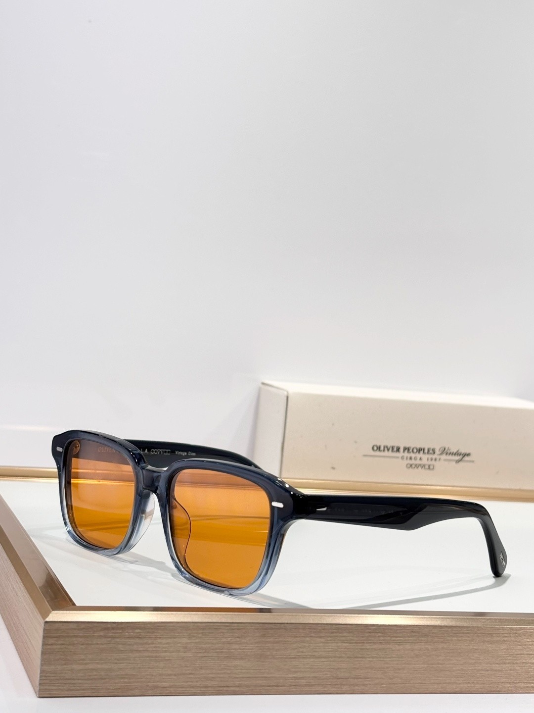 Oliver Peoples OV5562SU Sunglasses Square Blue Gradient Frame Orange Lens