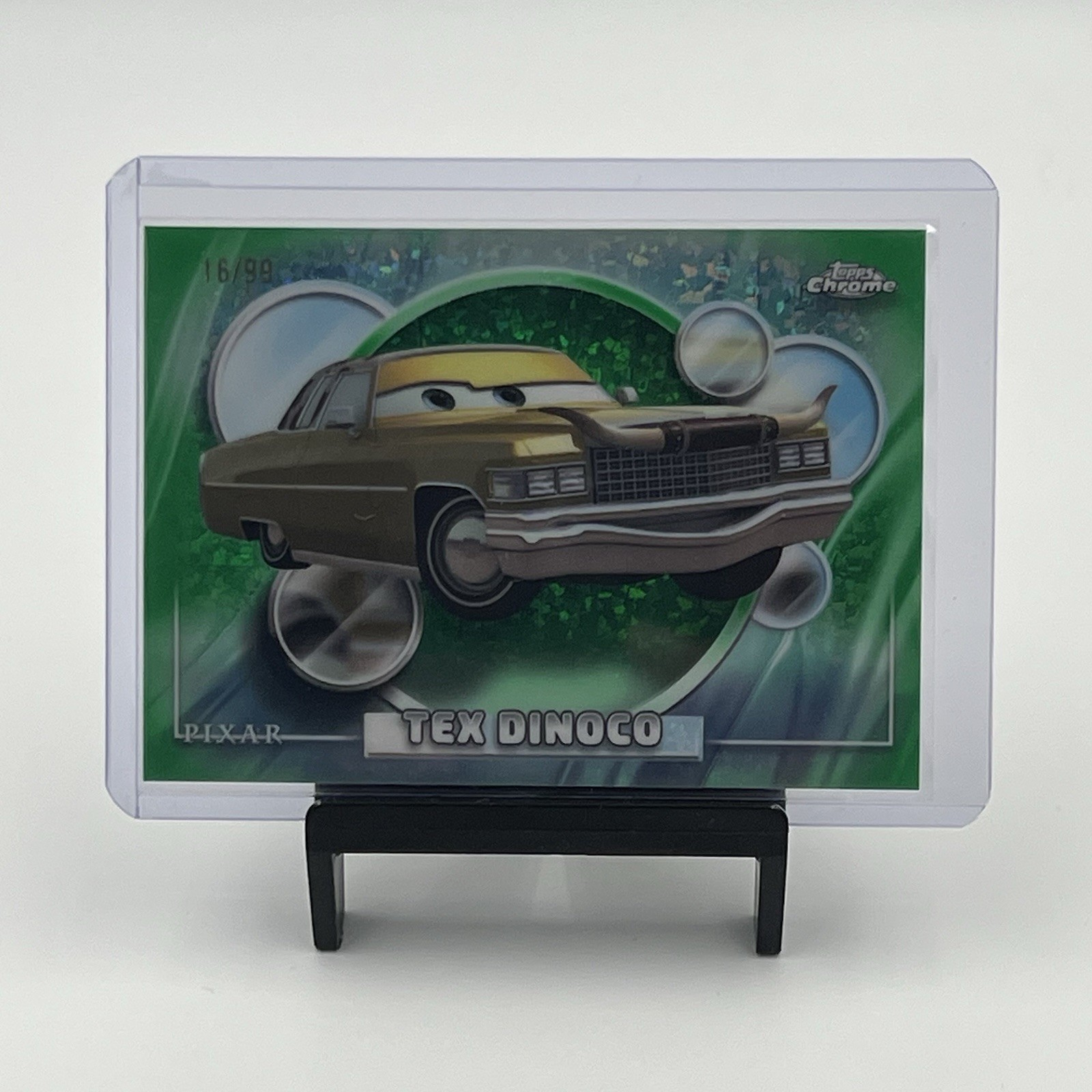 2026 Topps Chrome Disney Pixar Tex Dinoco #19 Green Mini Diamond 16/99 Parallel