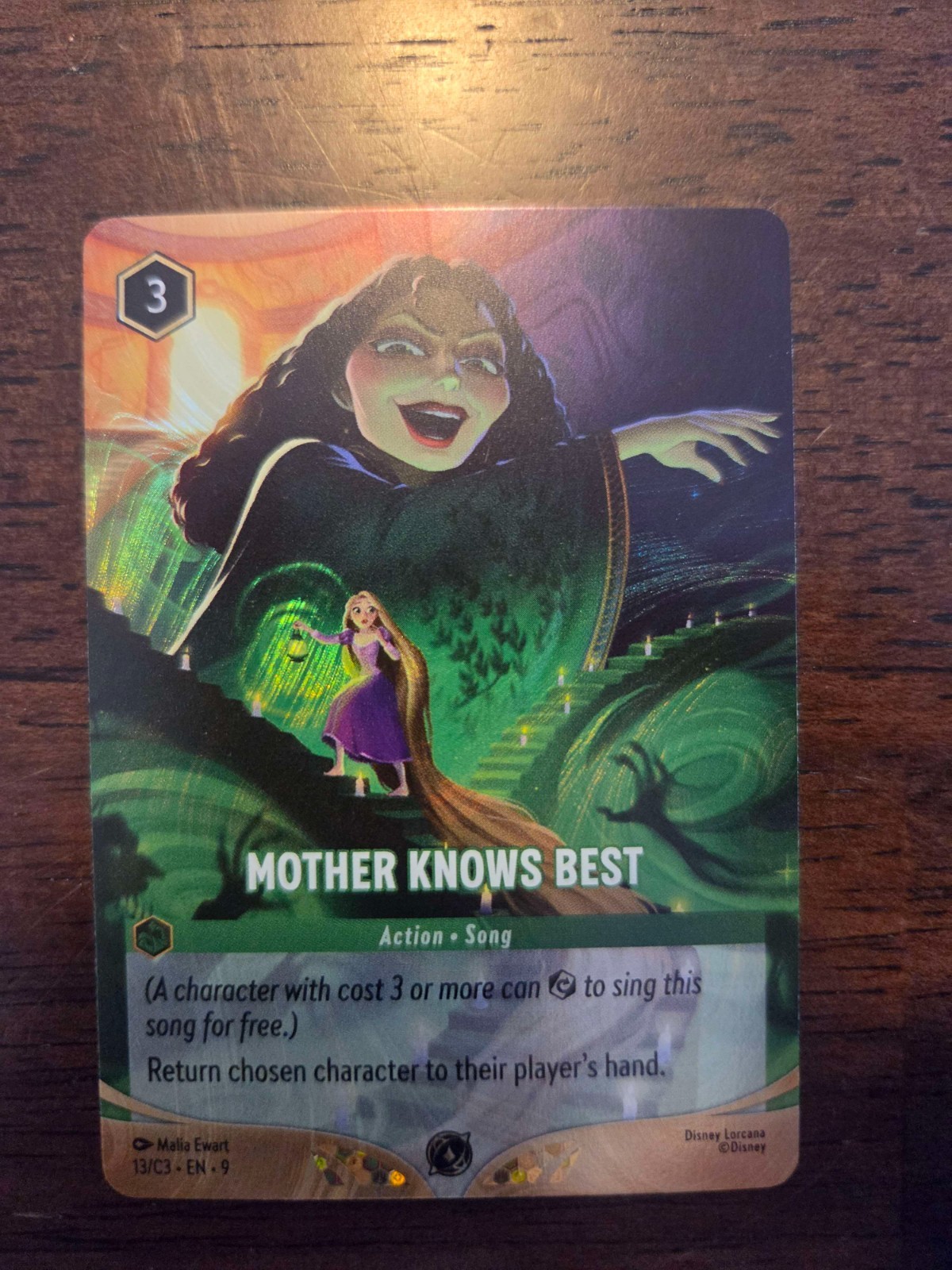 Disney Lorcana – Mother Knows Best • Foil • Top 32 CCQ Season 3 Exclusive Promo Disney Lorcana – Mother Knows Best • Foil • Top 32 CCQ Season 3 Exclusive Promo