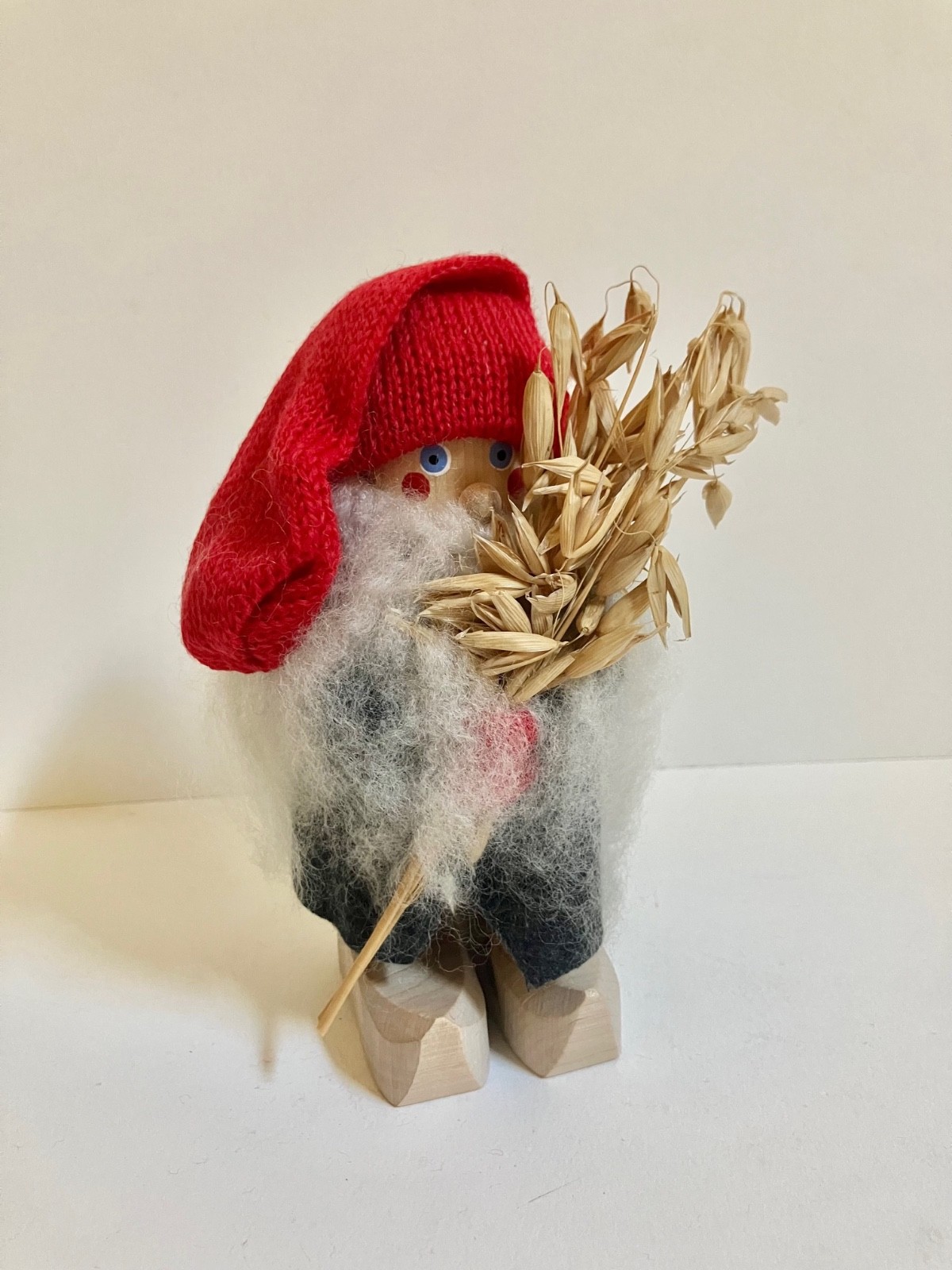 Wooly Wooden Swedish Tomte holding Oats 6.5