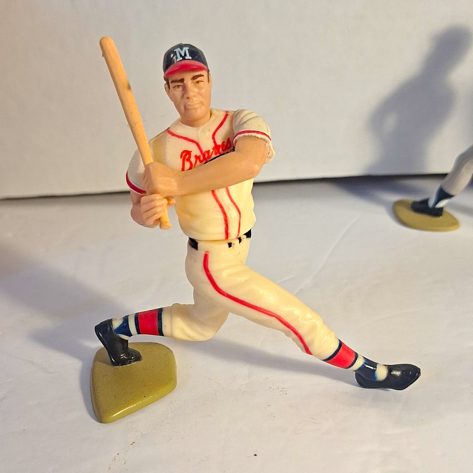 This appears to be a vintage 1989 Kenner Starting Lineup Eddie Mathews Figurine.