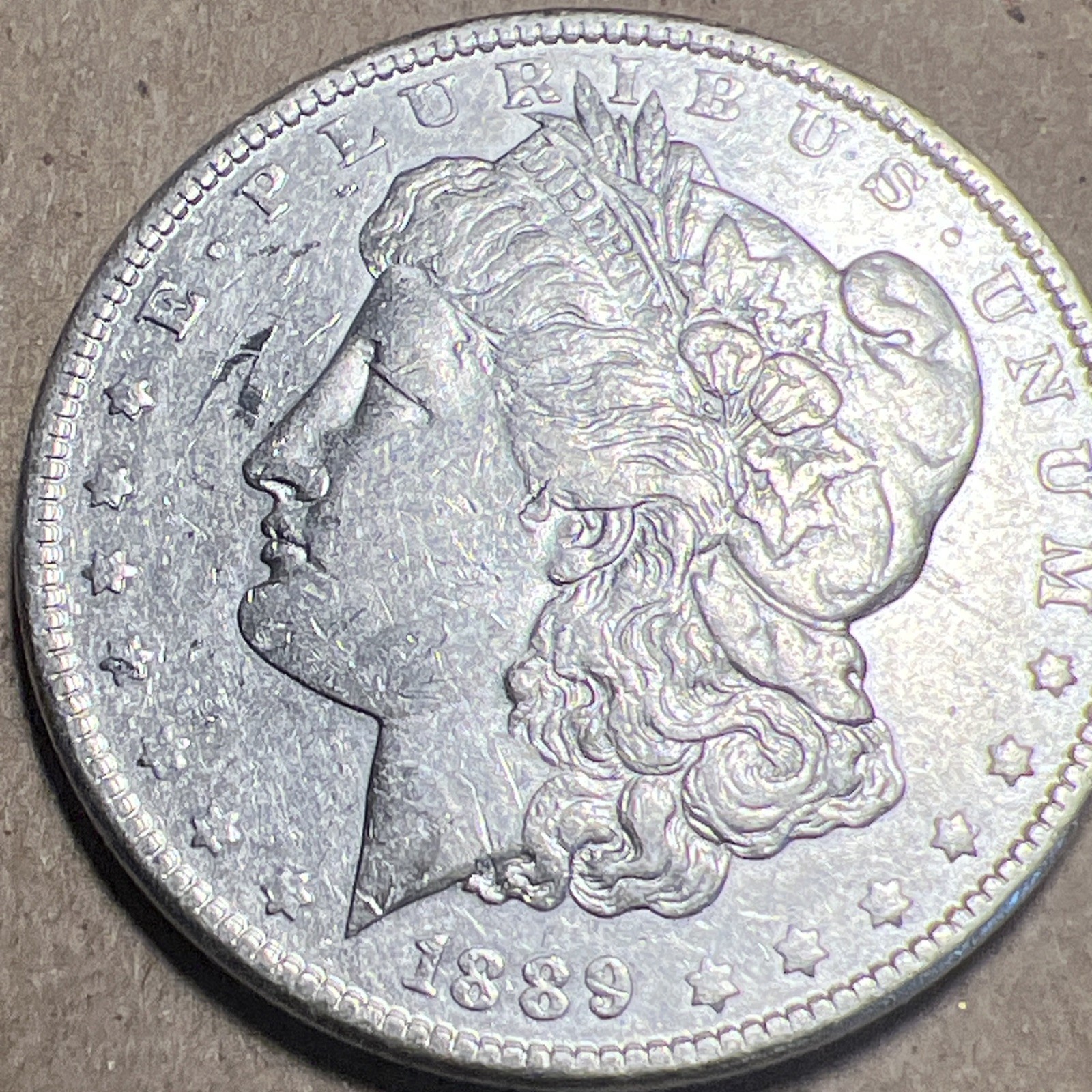 1889 P Morgan Silver Dollar AU/UNC. Normal Wear And Tear.