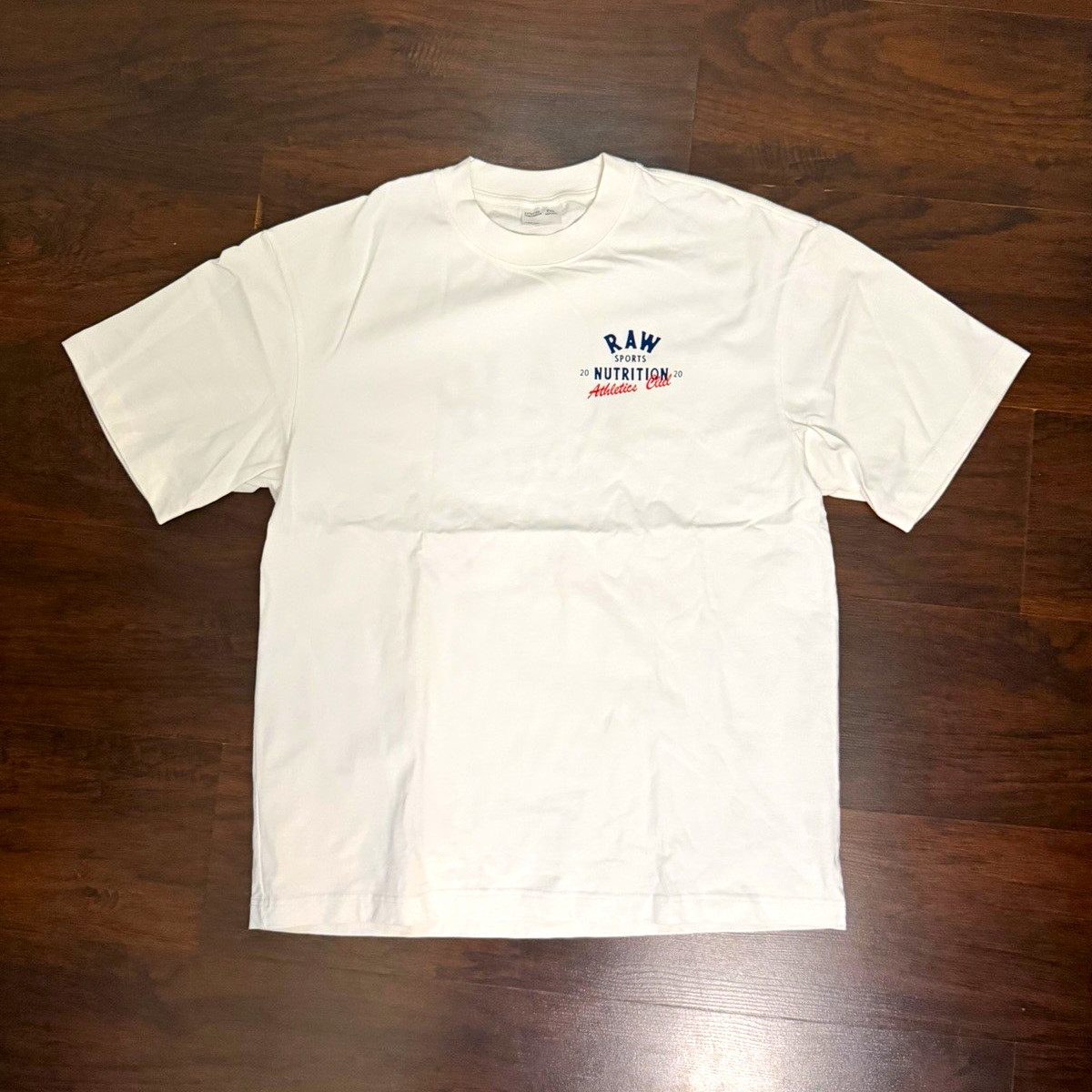 RAW Sports Nutrition Athletics Club White Graphic Logo Crew Neck T-Shirt 2XL RAW Sports Nutrition Athletics Club White Graphic Logo Crew Neck T-Shirt 2XL