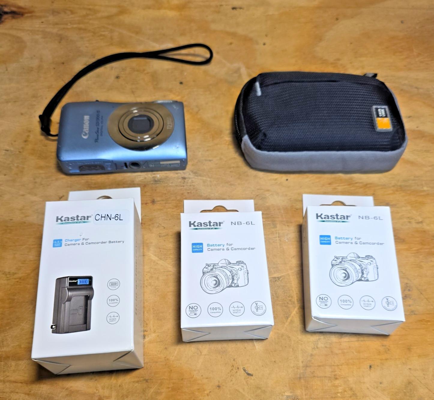 Canon PowerShot SD1300 IS ELPH 12.1MP Camera, Charger, Two New Batteries, Bag