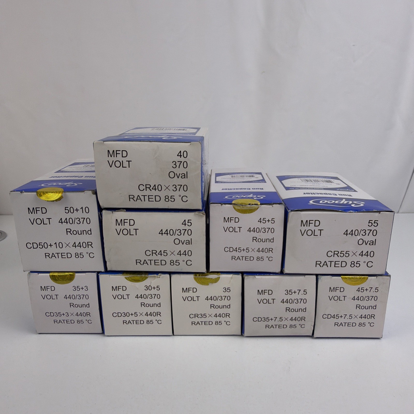 Lot of 10 NEW Supco HVAC Run Capacitors – Mixed MFD, 370/440VAC, Round/Oval Lot of 10 NEW Supco HVAC Run Capacitors – Mixed MFD, 370/440VAC, Round/Oval