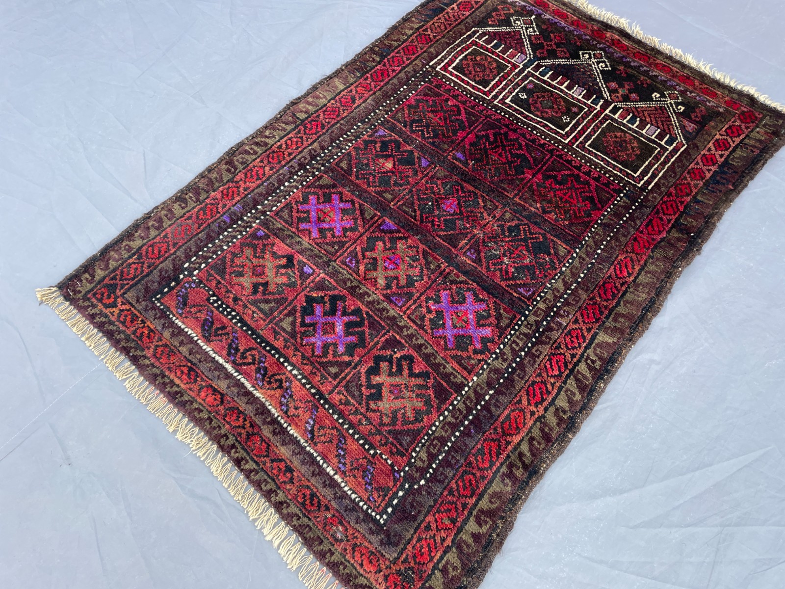 2x3 Vintage Baluchi Wool Rug with Repeating Tribal Panels and Layered Geometric