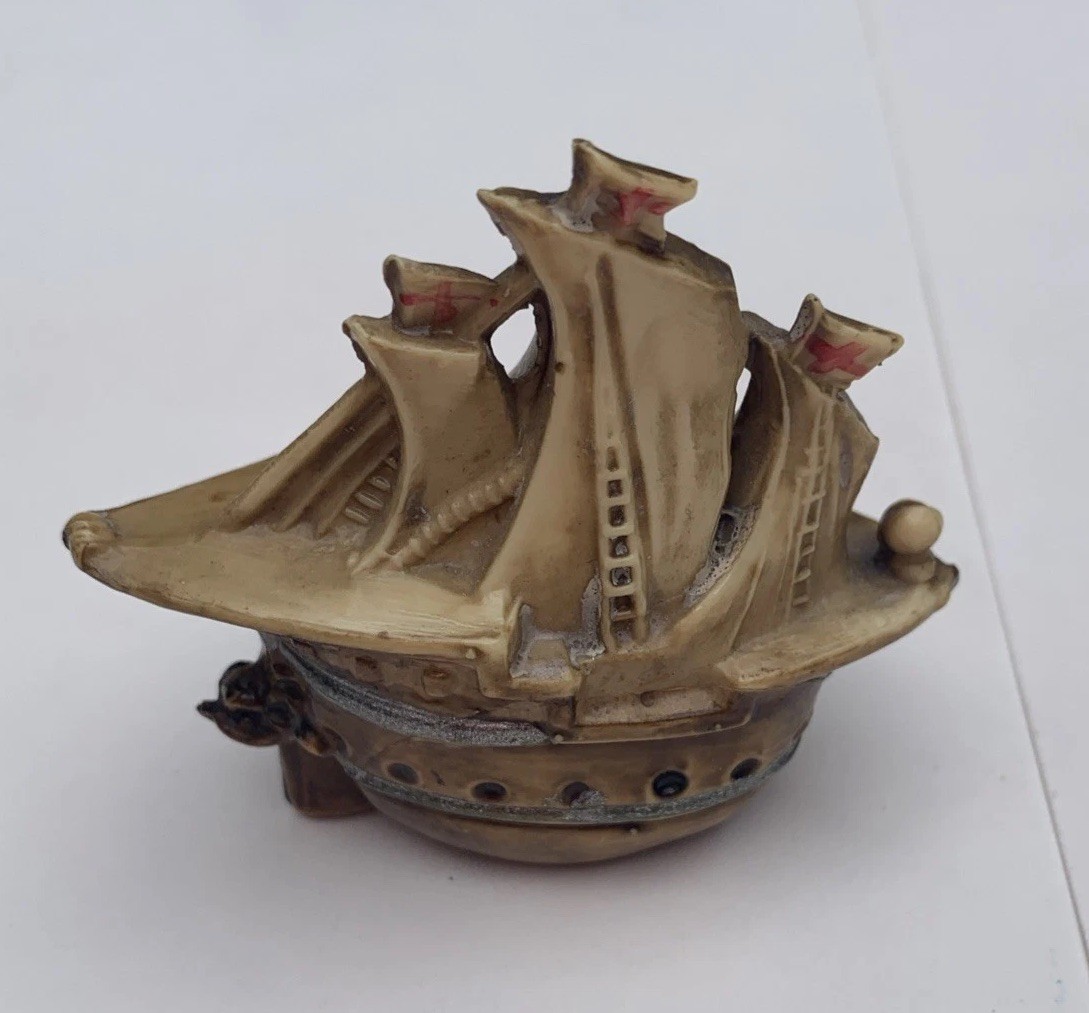 Antique Celluloid Sailing Ship Boat Flags Tape Measure that has tape lost in it 