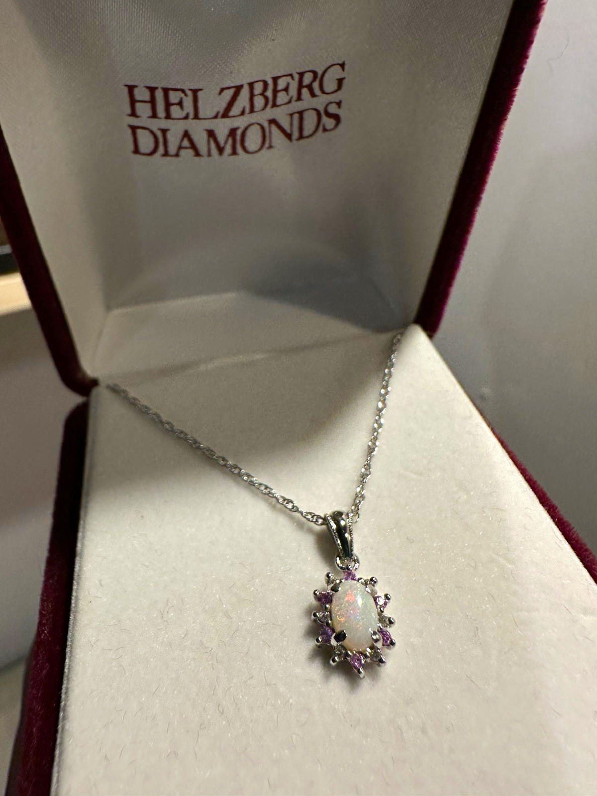 oval opal and diamond sunburst pendant in white gold from Helzberg Diamonds