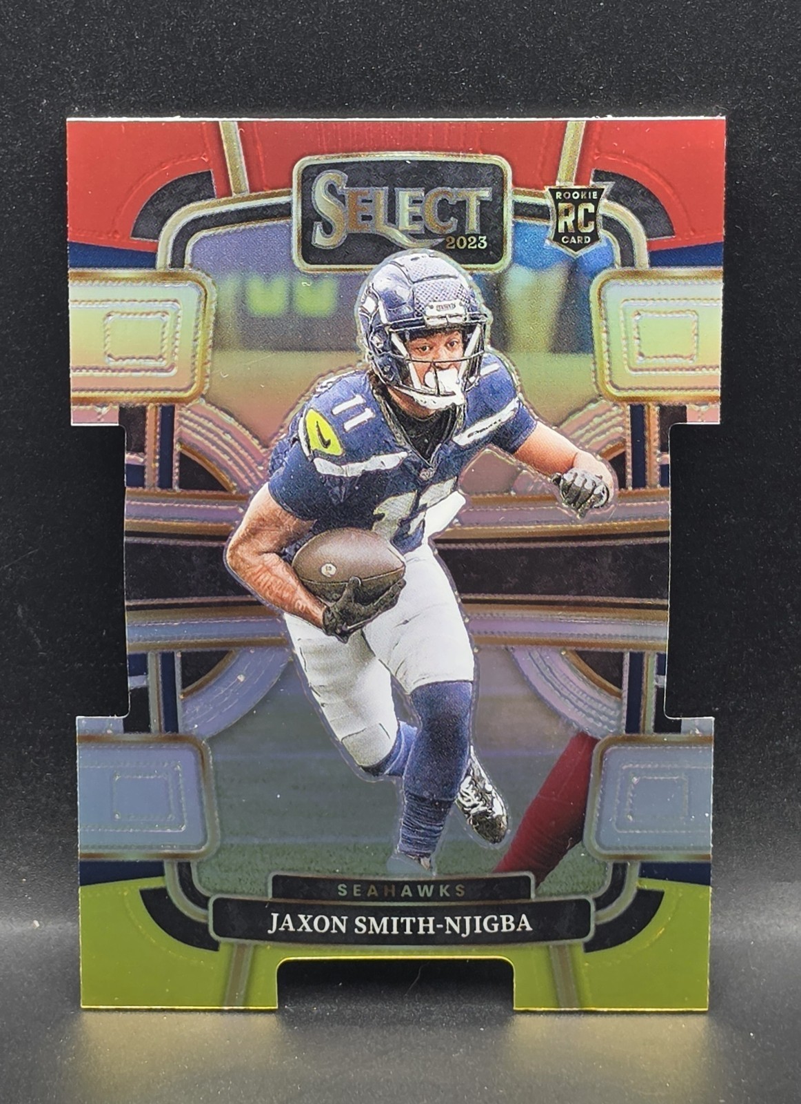 2023 Panini Select - Concourse Jaxon Smith-Njigba #87 Red & Yellow Prizm Die-Cut 2023 Panini Select - Concourse Jaxon Smith-Njigba #87 Red & Yellow Prizm Die-Cut
