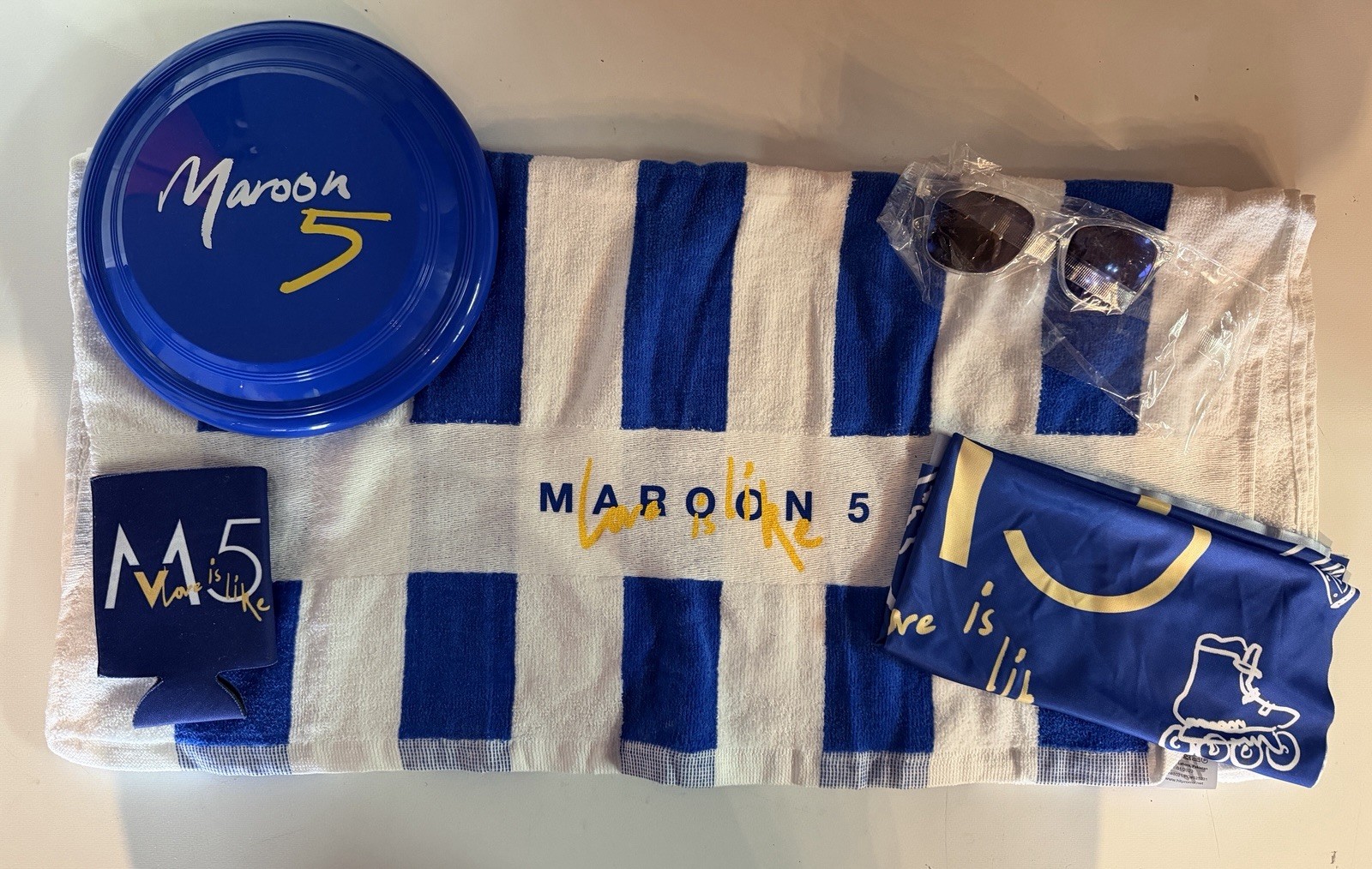Maroon 5 Love Is Like Beach Towel Sunglasses & More Promo