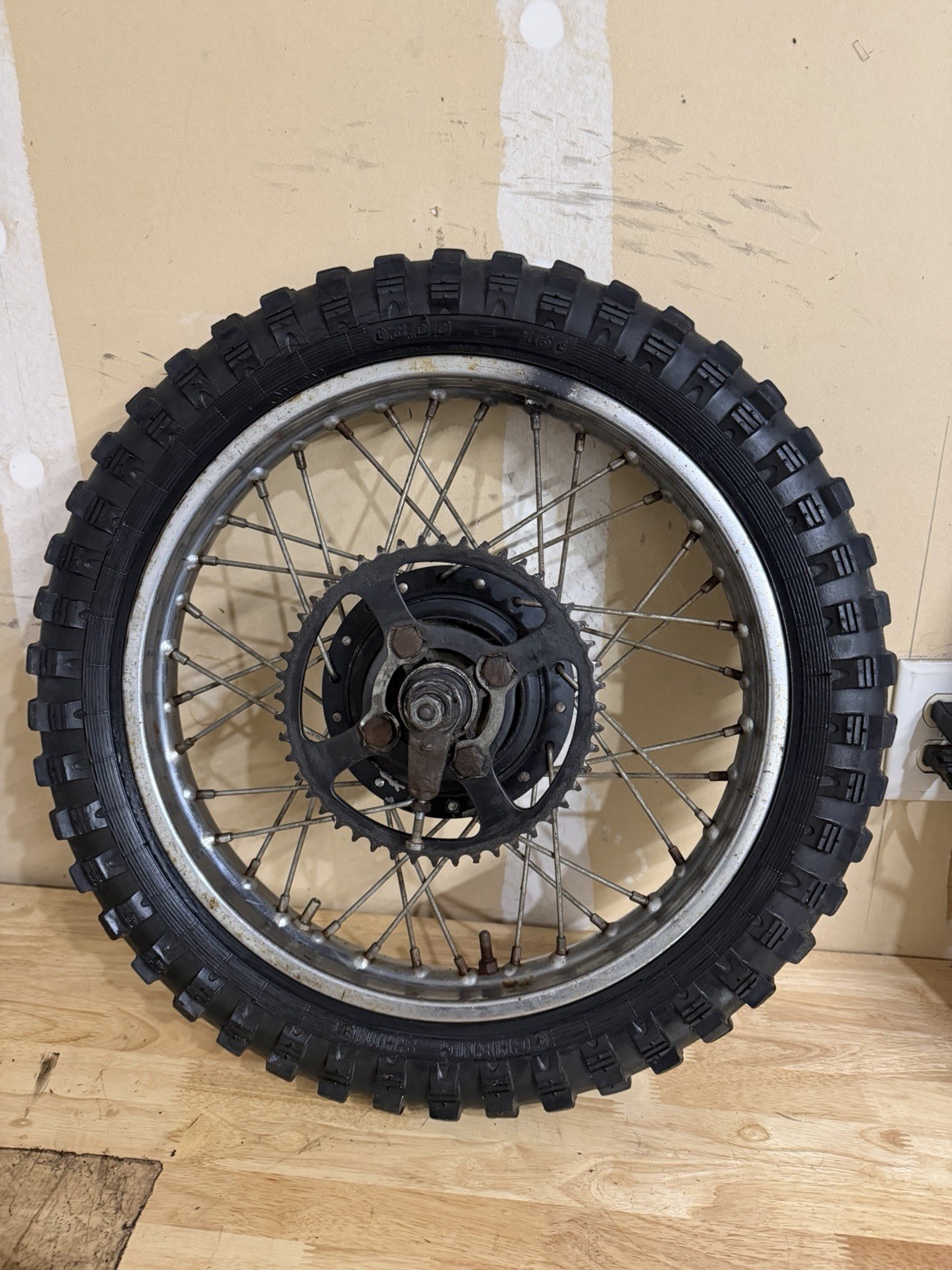 **1977-1983 YAMAHA MX100 REAR WHEEL WITH AXLE**OEM**