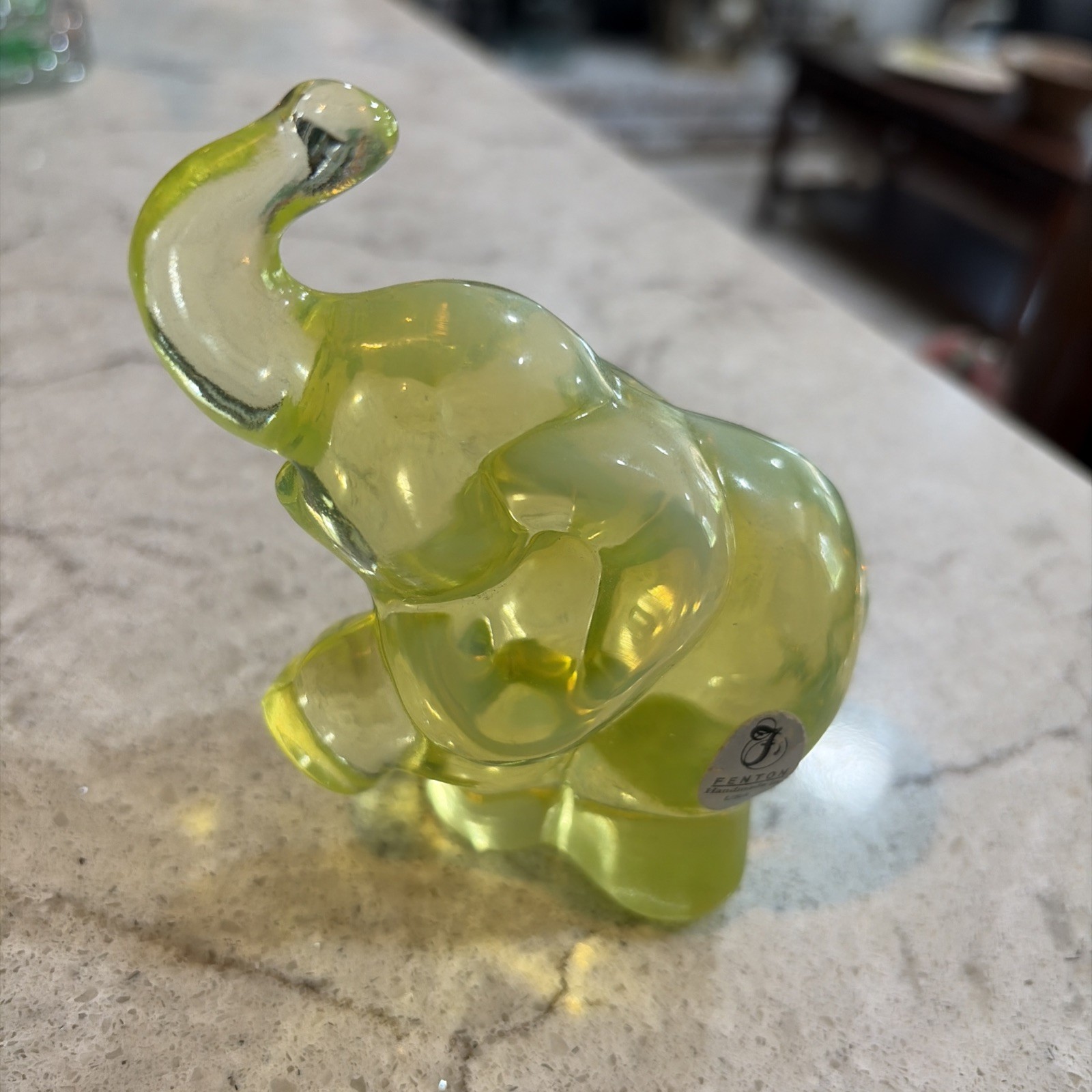 Vintage Fenton Vaseline Uranium Opalescent Glass Trunk Up Elephant. With label.