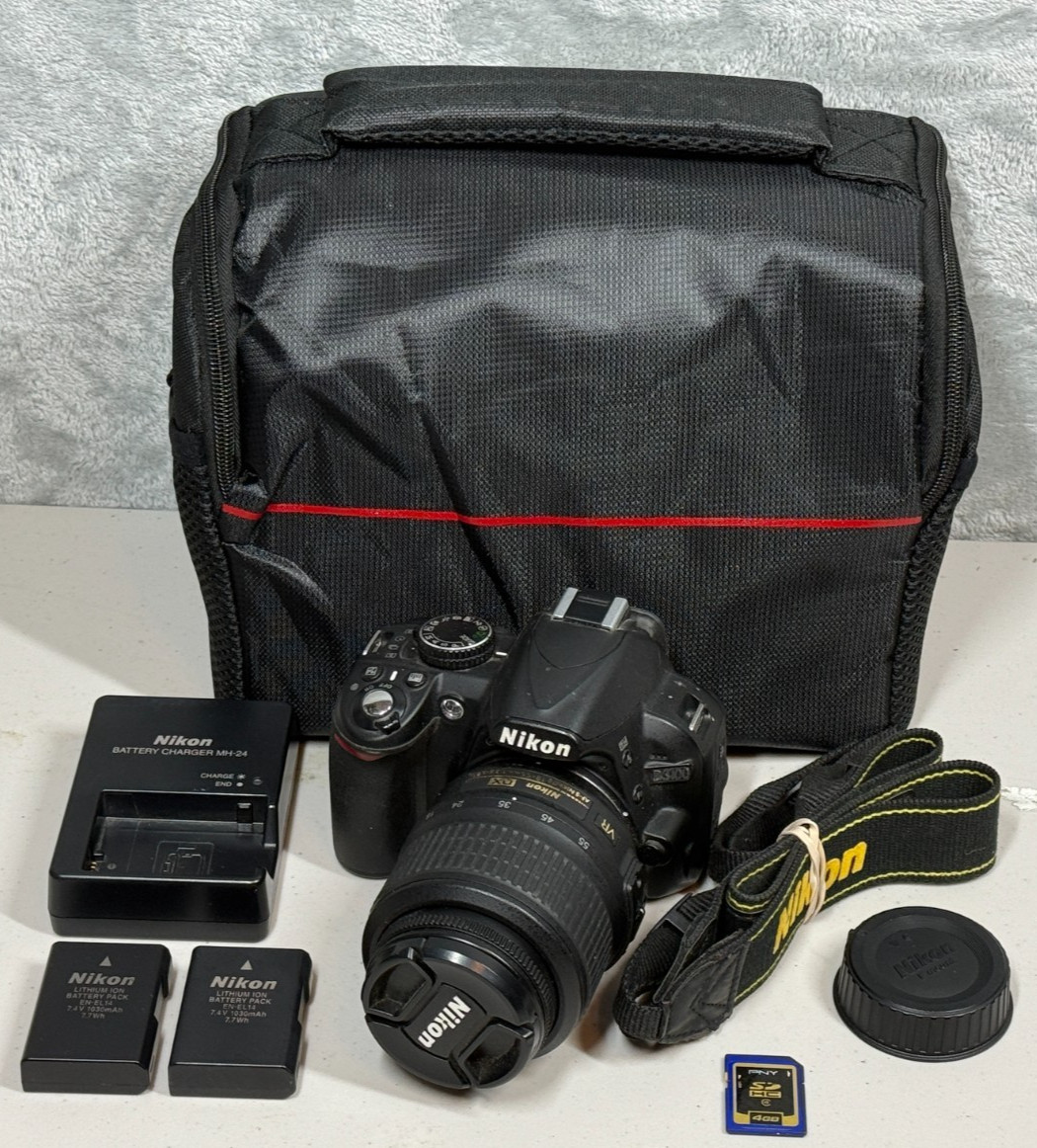 Nikon D3100 DSLR Camera W/ 18-55mm VR Lens - Bundle - Battery Charger SD Card Nikon D3100 DSLR Camera W/ 18-55mm VR Lens - Bundle - Battery Charger SD Card