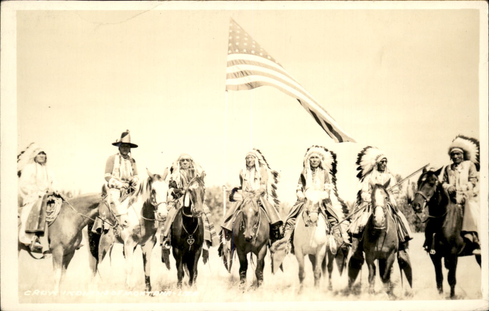 Billings MT Photog Crow Native American Indians American flag c1920 RPPC bhn Billings MT Photog Crow Native American Indians American flag c1920 RPPC bhn