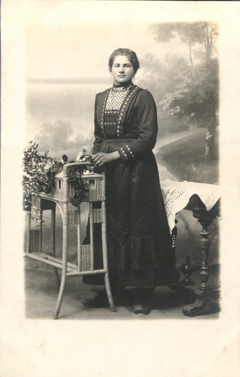 CIRA 1900\'s Woman in Black Dress By Potted Plants & Tables With Lace RPPC