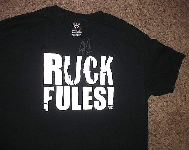 Vintage WWE black RUCK FULES John Cena AUTOGRAPHED Wrestlemania Shirt (fits M) Vintage WWE black RUCK FULES John Cena AUTOGRAPHED Wrestlemania Shirt (fits M)