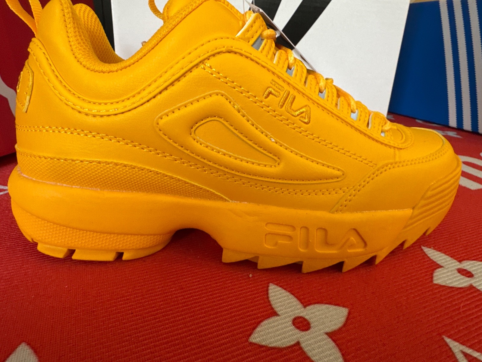  Fila Disruptor II Premium sneaker with a chunky, serrated platform sole and ton