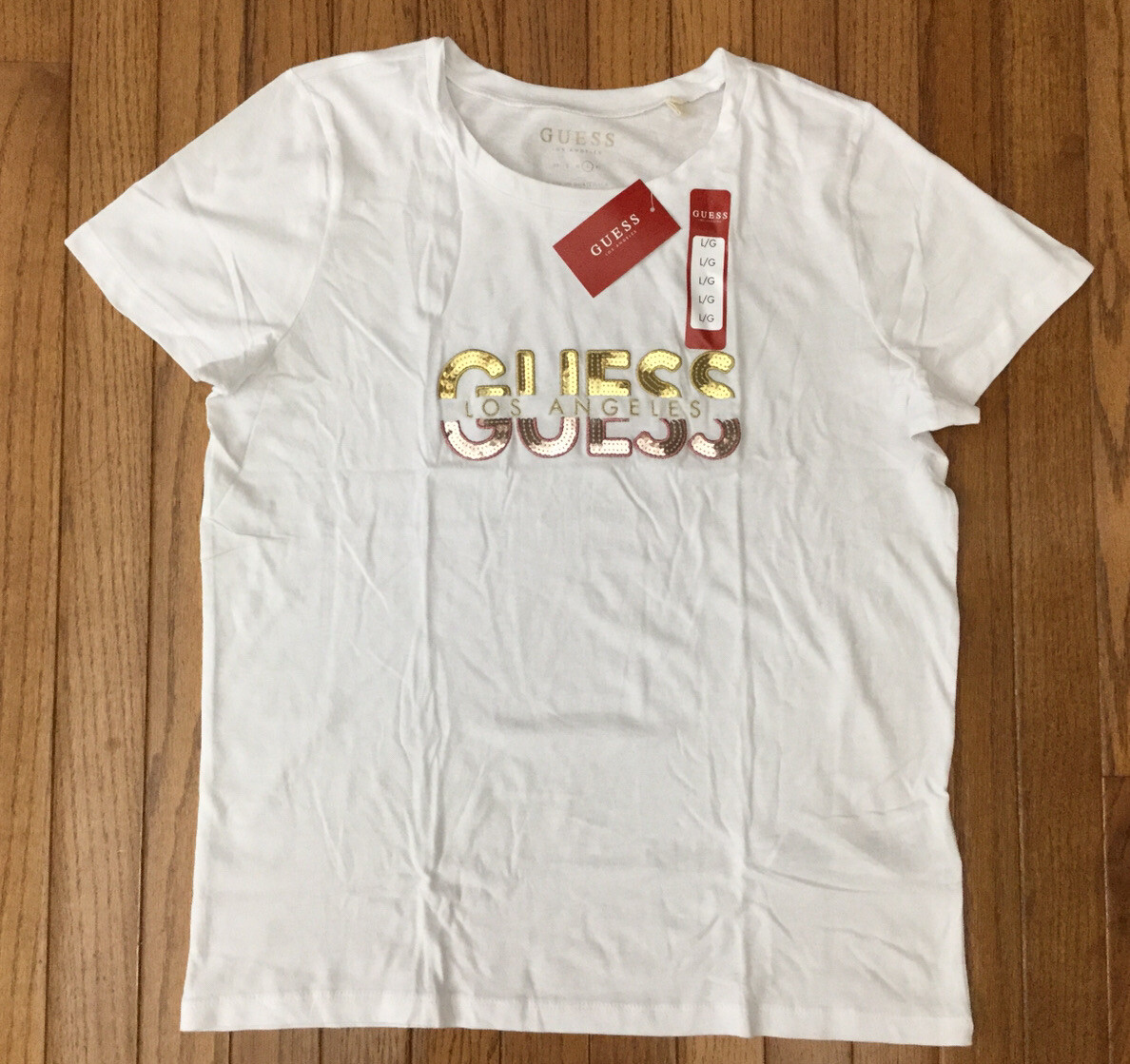 New GUESS Woman’s White Sequins Logo Tee Shirt Top T-shirt Sz L MSRP $27 New GUESS Woman’s White Sequins Logo Tee Shirt Top T-shirt Sz L MSRP $27