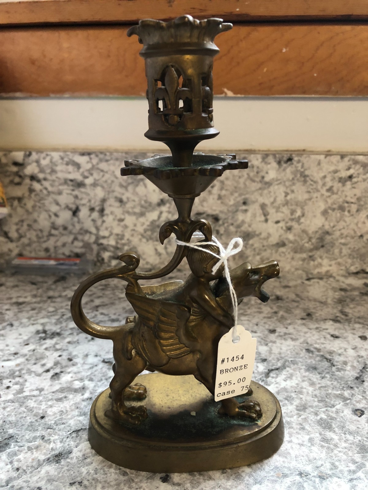 Cast bronze figural candlestick modeled as a winged griffin/dragon (chimera)