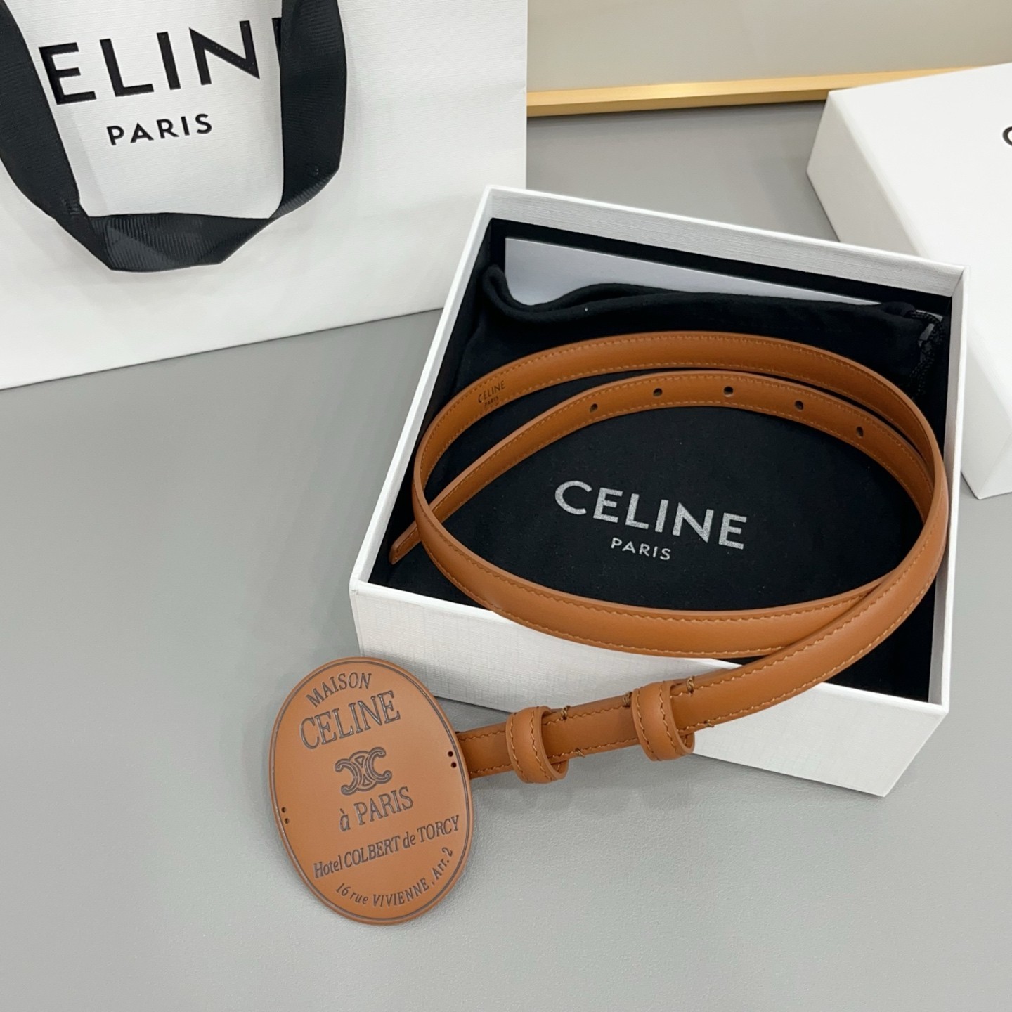 CELINE Women\'s Tan Brown Thin Belt Maison Paris Oval Statement Buckle. CELINE Women\'s Tan Brown Thin Belt Maison Paris Oval Statement Buckle.