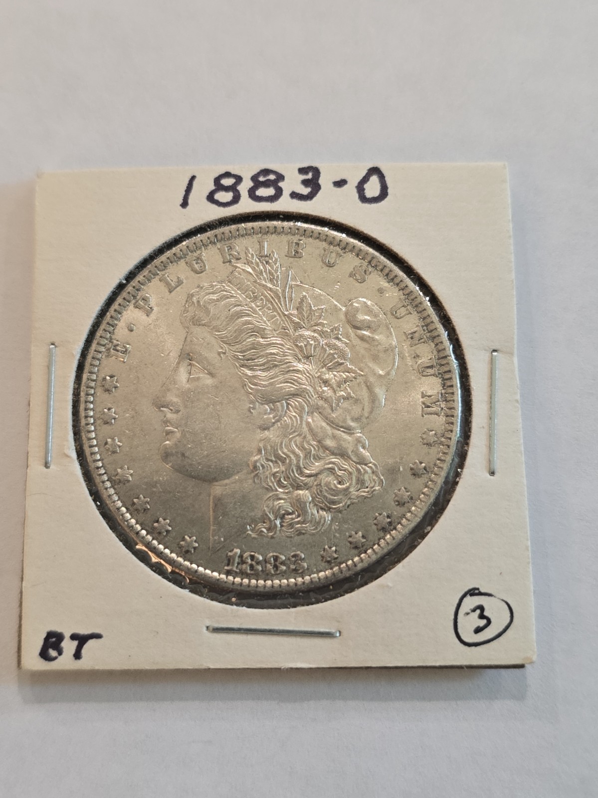 1883 O Morgan Silver Dollar. EF to Near Mint