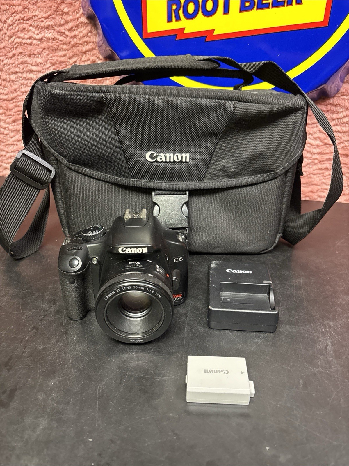 Canon EOS 450D / Rebel XSi + Canon EF 50mm f/1.8 STM Lens + Battery Canon EOS 450D / Rebel XSi + Canon EF 50mm f/1.8 STM Lens + Battery