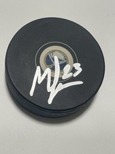 Mattias Samuelsson Signed Puck Buffalo Sabres Beckett BAS COA IP Hockey NHL a picture