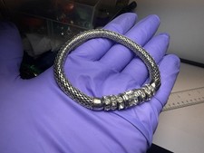 By Anthropologie Glitzy Cha Bangle Bracelet.  Silver picture