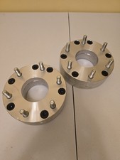 These are 2-inch thick aluminum wheel adapters designed to convert a... picture