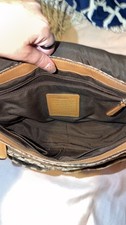 vintage coach purse/satchel has one spot rest is perfect. Brown tan and white. picture