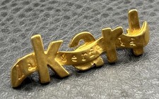 Vintage Karl Lagerfeld Signed Gold Tone Name Logo Ribbon Brooch Bar Pin picture