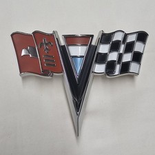 1963-1964 Corvette Front Nose X-Flag Emblem Molding 3797400 NEW picture