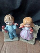 Cute kids using vintage telephones figurines picture