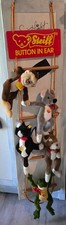 Steiff animals on a rope ladder store display. picture