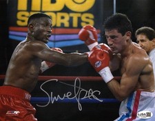 Pernell 'Sweet Pea' Whitaker Signed Boxing Punching Action 8x10 Photo -(JSA COA) picture