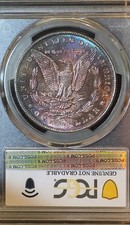 1886 Morgan Silver Dollar PCGS Genuine UNC Detail -MONSTER Rainbow Toned REV picture