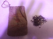 Rare Lionel No. 165-83 Steel Blanks partially full bag and full No.919 grass bag picture