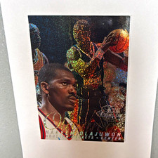 Fleer/SkyBox 1997-98 Metal Universe Hakeem Olajuwon #14 Rockets PMG Row 0 picture