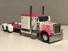 NEW 1/64 DCP PINK PETERBILT 379 60