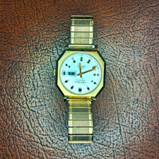 Caravelle Automatic Men's Octagon Day/Date Silver Dial Gold/Silver Bracelet picture
