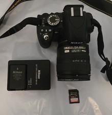 Nikon D3100 DSLR Camera Bundle w/ 18-70mm Lens, Battery/Charger, 128GB & Bag picture
