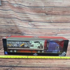 New Ray Diecast/plastic 1/32 scale Mack semi w/ Mack construction series trailer picture