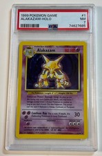 1999 Pokemon Base Set ALAKAZAM Holo #1 PSA 7 NM picture