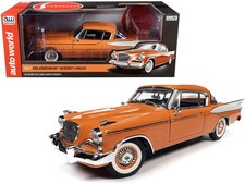 Auto World 1957 Studebaker Gold Hawk Coppertone Orange & White 1/18 Diecast picture