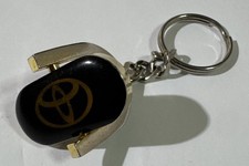 Vintage Toyota Key Chain. Logo And Spell Out Flipping Key Chain Black And Gold picture