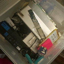 Lot of random computer/tech parts from batteries to mother boards to screens picture