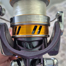 Daiwa Regal LT 3000D-C Spinning Reel 10BB 6.2:1 Left Retrieve Purple/Gold picture