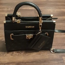 New Bebe black leather handbag with crossbody strap picture